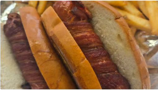 Nathan’s bacon-wrapped hot dog on a toasted bun with fries